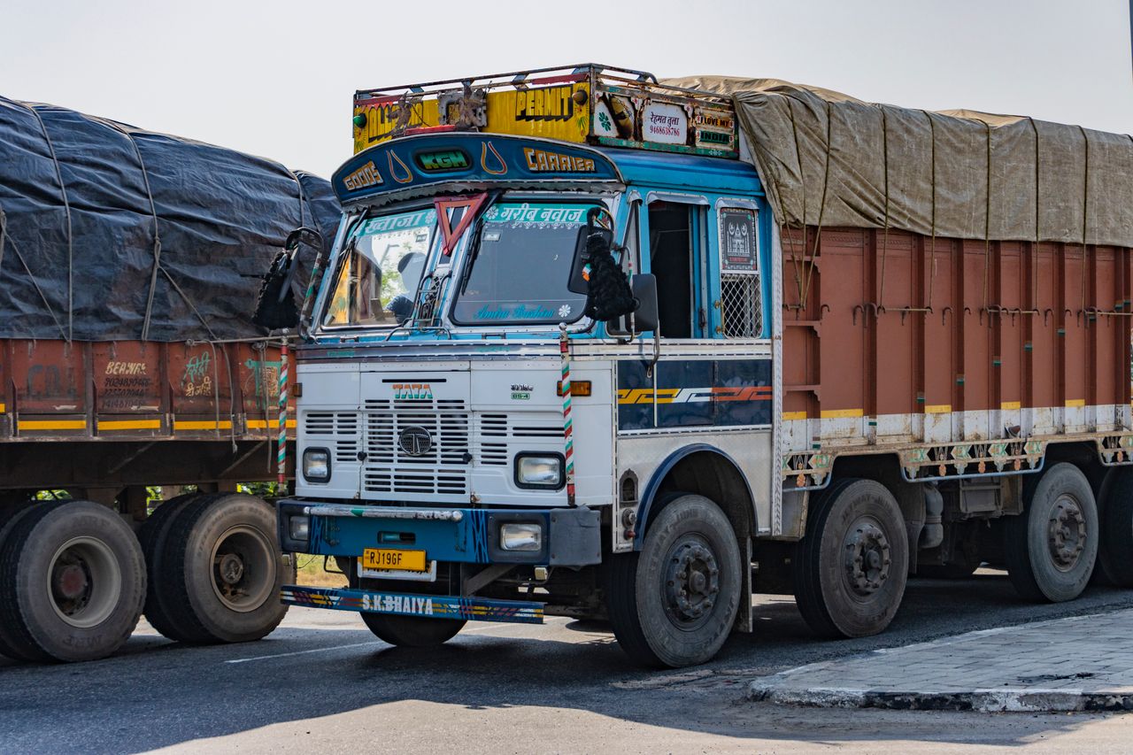 Beranda Vibrant Tata truck on an Indian highway near Deeg, Uttar Pradesh showcasing cultural designs.
